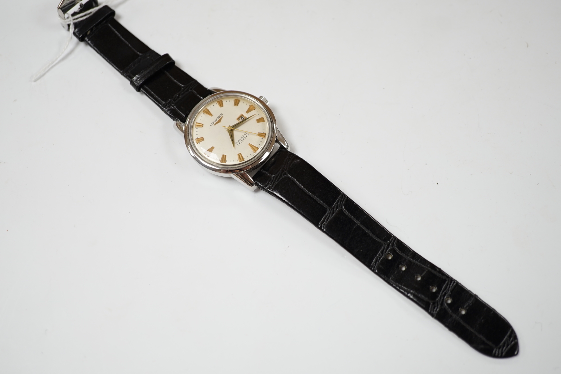A gentleman's stainless steel Longines Conquest Calendar manual wind wrist watch, on Longines leather strap with Longines buckle, case diameter 35mm.